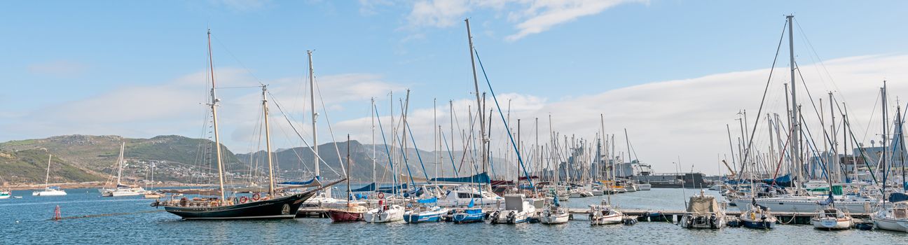 CAPE TOWN, SOUTH AFRICA - DECEMBER 12, 2014:  Simons Town harbor with two South African Navy Valour class frigates and S99, the SAS Assegaai, a Daphne class submarine, now a museum item, in the back