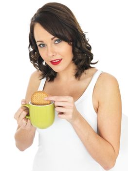 Attractive Young Woman With Tea and Biscuits