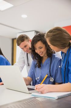 Medical students sitting and talking at the university