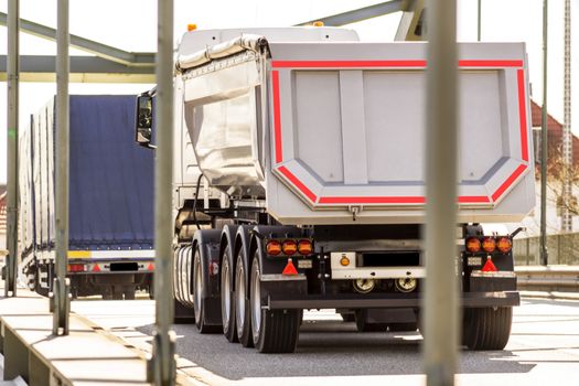 Truck driving over a bridge