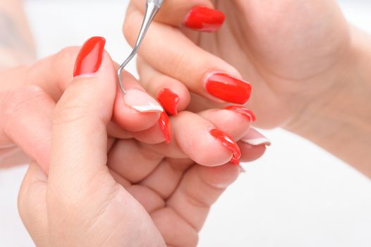 beauty salon, manicure applying, cleaning the cuticles