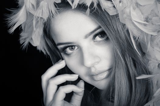 Young beautiful woman thinking, slightly toned black and white portrait 