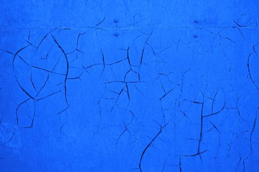  Blue cracked wall as an abstract background                              