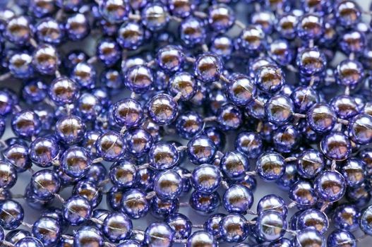 Background of lilac glass large beads shiny                              