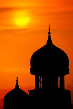 Silhouette of a mosque in sunset.