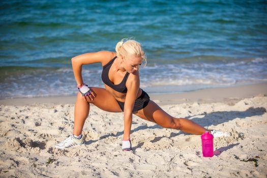 fitness and lifestyle concept - woman doing sports outdoors