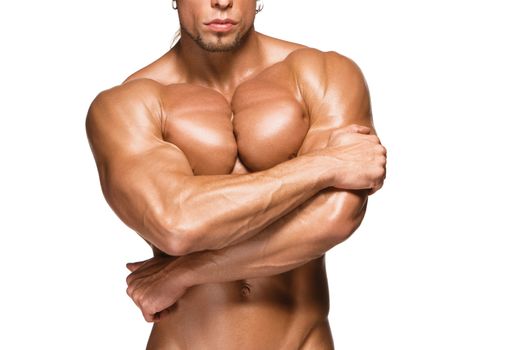 torso of attractive male body builder, isolated on white background.