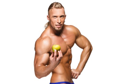 Shaped and healthy body man holding a fresh apple fruits, isolated on white background