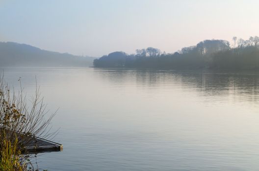 View of the Baldeneysee in morning fog