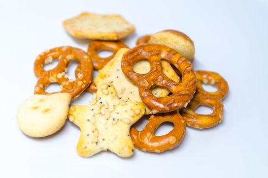 Salt pastries, snacks against white background.