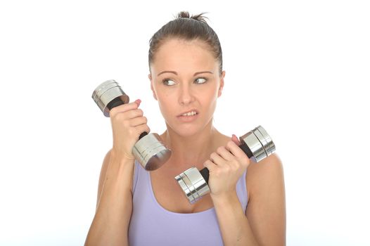 Healthy Young Woman Training With Dumb Bell Weights Looking Fed Up