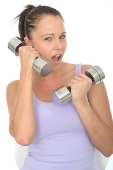 Healthy Young Woman Playfully Using a Dumb Bell Weight like a Cell Phone