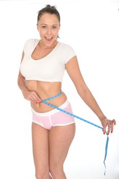 Healthy Fit Young Woman Checking Her Weight Loss With a Tape Measure