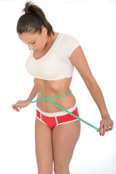 Healthy Fit Young Woman Checking Her Weight Loss With a Tape Measure