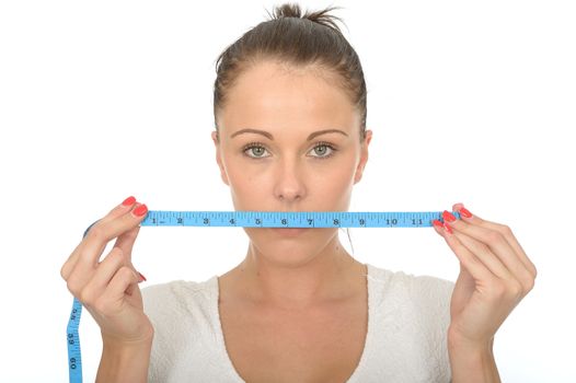 Healthy Young Woman Holding a Coloured Cloth Tape Measure