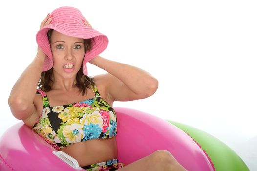 Attractive Young Woman Sitting in Rubber Rings Wearing a Swimsuit