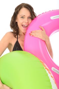 Happy Young woman On Holiday Holding Inflated Rubber Rings Laughing and Smiling