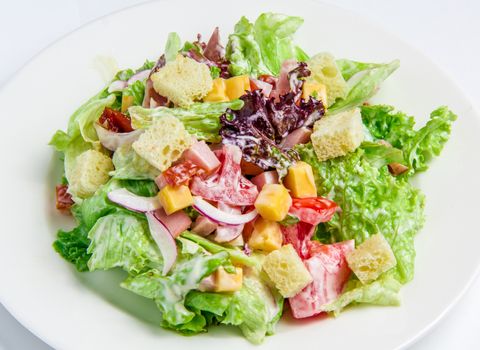 The Caesar Salad on  a white plate