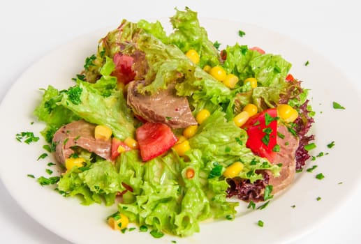 Salad with boiled beef, corn, tomatoes, sauce with capers