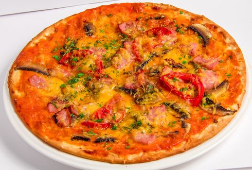 Tasty italian Pizza cooked with bacon and tomatoes