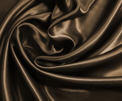 Smooth elegant golden silk or satin can use as background. In Sepia toned. Retro style