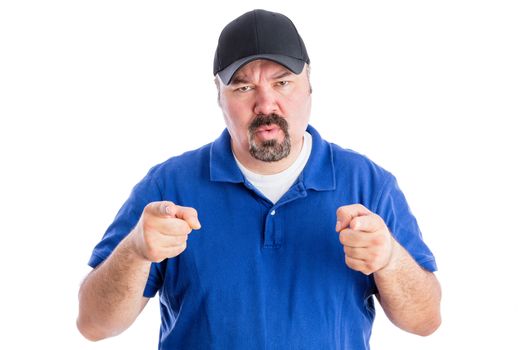 Puzzled middle-aged man with a goatee wearing a baseball cap pointing at the camera with a quizzical frown as he seeks clarification, isolated on white
