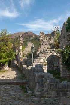 The high fortress walls with the scenic mountains on the background, Stari Bar, Montenegro.