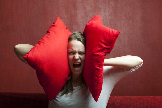 young woman with cushions