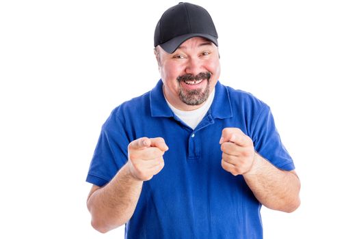 Gleeful happy middle aged man in casual clothes pointing at the camera with a playful amused expression, isolated on white