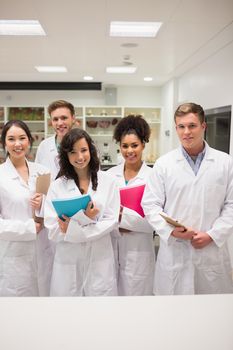 Medical students smiling at camera at the university