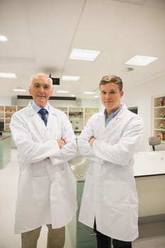 Science student and lecturer smiling at camera at the university