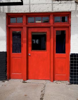 Image of an old door painted a vibrant red