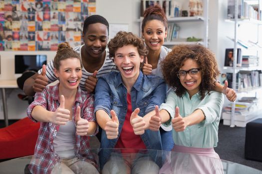 Fashion students smiling at camera together at the college