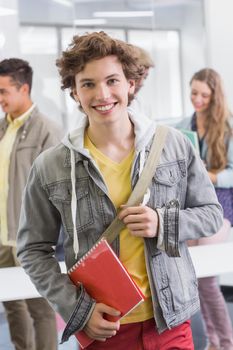 Fashion student smiling at camera at the college