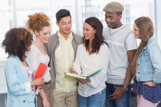 Fashion students chatting and smiling at the college