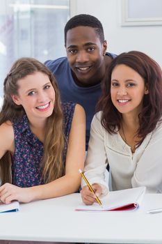 Students working together in class at the college