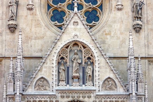 Gable triangle above the main entrance to the Cathedral of Assumption of the Blessed Virgin Mary in Zagreb, Croatia with statue of Christ the Teacher