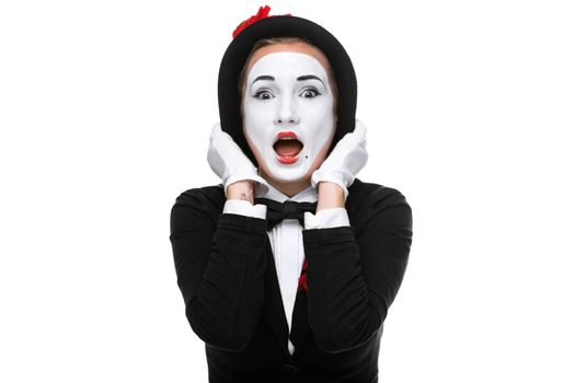Portrait of the surprised woman as mime isolated on white background. Concept of surprise and admiration