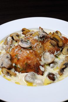 baked chicken in a creamy milk gravy with mushrooms