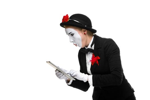 surprised business woman in the image mime holding tablet PC isolated on white background