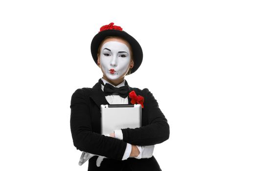 business woman in the image mime holding tablet PC and  easy looking at the camera. isolated on white background