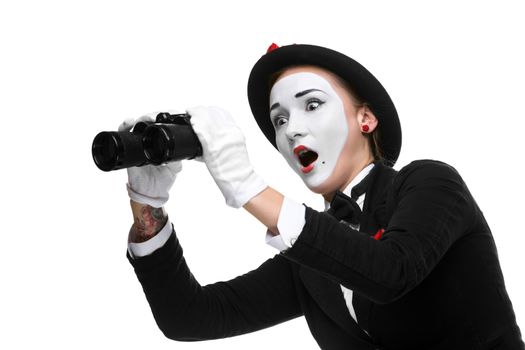 Portrait of the surprised and joyful woman as mime with binoculars isolated on white background. Concept unexpected and joyful discovery