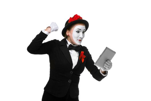 angry business woman in the image mime holding tablet PC isolated on white background