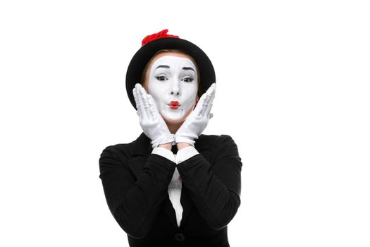 Portrait of the surprised and touched woman as mime isolated on white background. Concept of touched