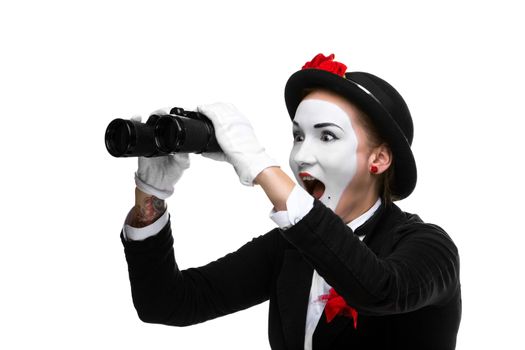 Portrait of the surprised and joyful woman as mime with binoculars isolated on white background. Concept unexpected and joyful discovery