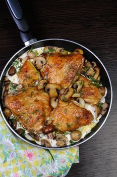 baked chicken in a creamy milk gravy with mushrooms