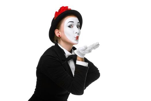 Portrait of the woman as mime sending a kiss isolated on white background. Concept of love