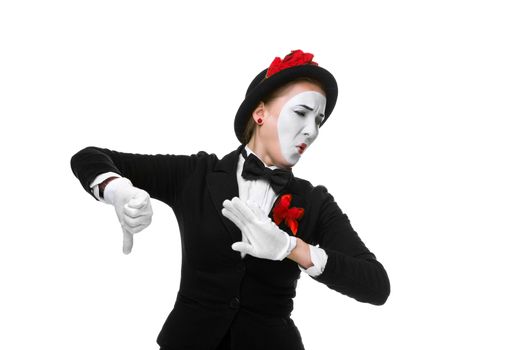 Portrait of the condemning woman as mime with dissatisfaction with a grimace on his face isolated on white background. Concept of  of rejection and condemnation