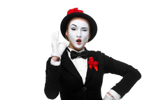 Portrait of the approving woman as mime showing that everything is fine, isolated on white background. 