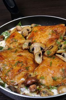 baked chicken in a creamy milk gravy with mushrooms